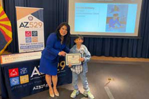 Kharliel receiving his award
