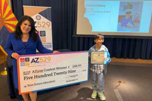 Kharliel receiving his check