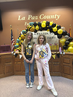 Sonora Whedbee and Vada King with their spelling bee badges